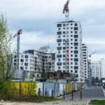 High-rise buildings and cranes in an urban construction site. Modern architecture.